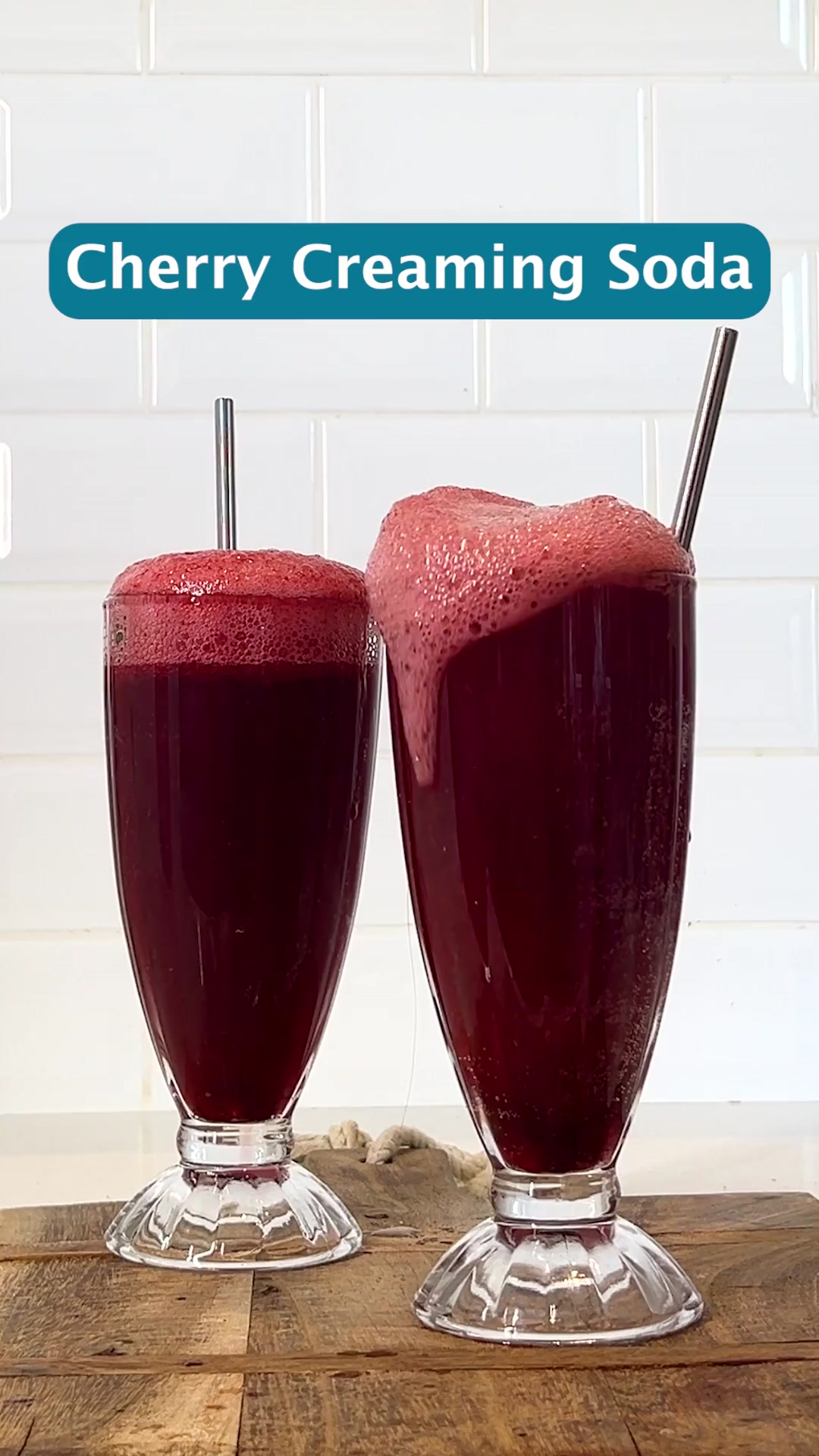 Two milkshake glasses with a red transparent liquid