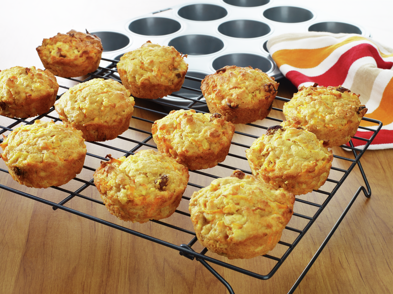 12 mini carrot cakes on a cooling rack