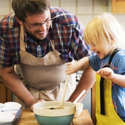 Adult and child cooking