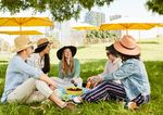5 Teens having a picnic in a park