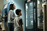 Mother and son in front of vending machines