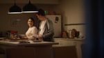 A still image from the Menu App tv advert showing a man and woman preparing a meal