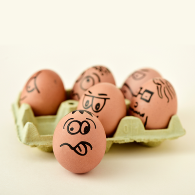 boiled eggs with faces drawn on