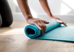 Rolling out yoga mat