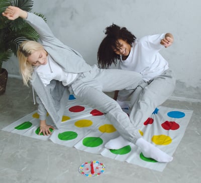 Two women play twister