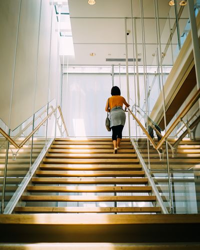 Woman walks up the stairs