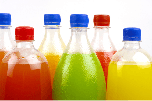 Bottles of brightly coloured soda