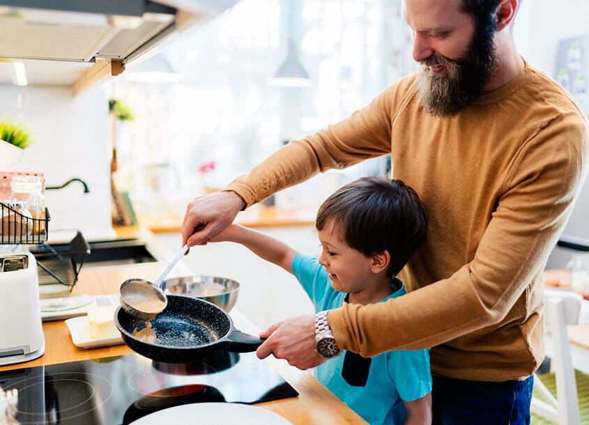 Father and son making healthy pancakes