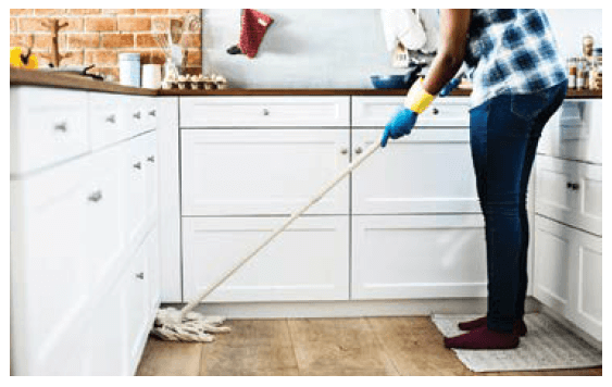 Man mops the kitchen