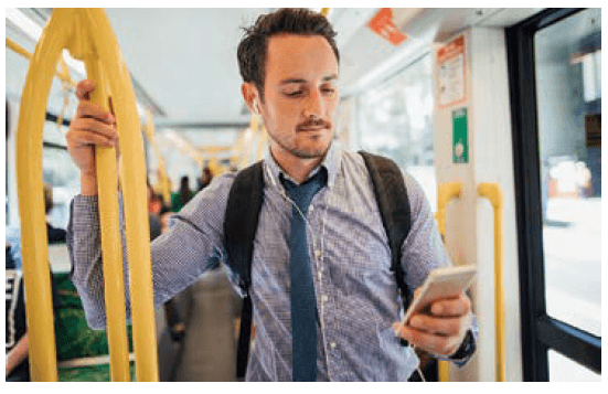 Man in business attire takes a train