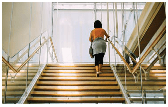 Woman walks up stairs