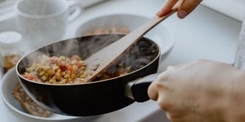 stiring food in a frypan