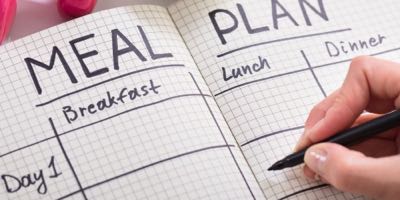 person filling out an empty meal plan