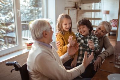 Multi-generational family enjoying a meal together