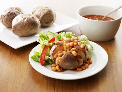 Baked potato with baked beans and a side salad