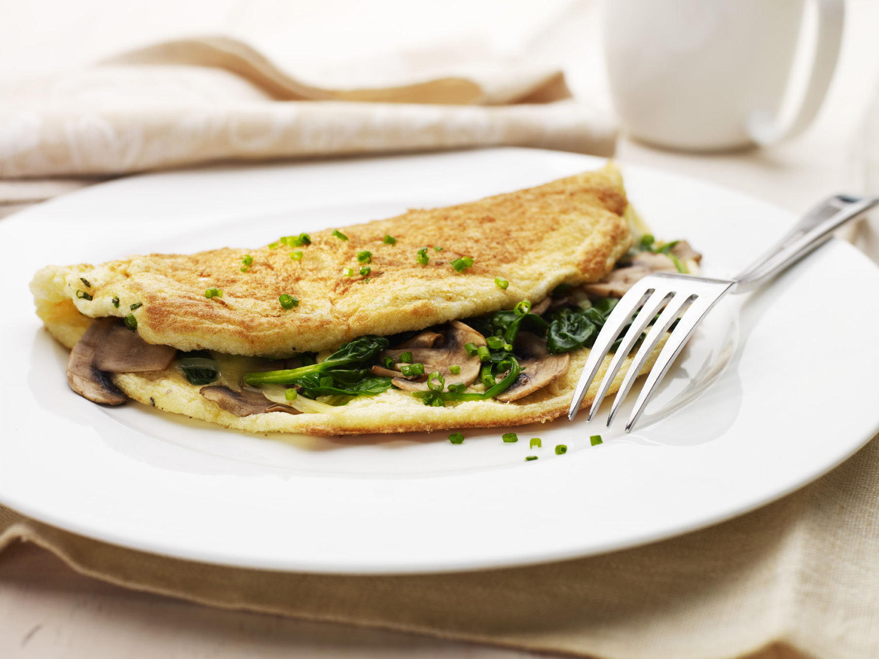 Fluffy spinach and mushroom omelette