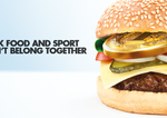 Burger with gold medal inside. Text reads 'junk food and sport don't belong together'.